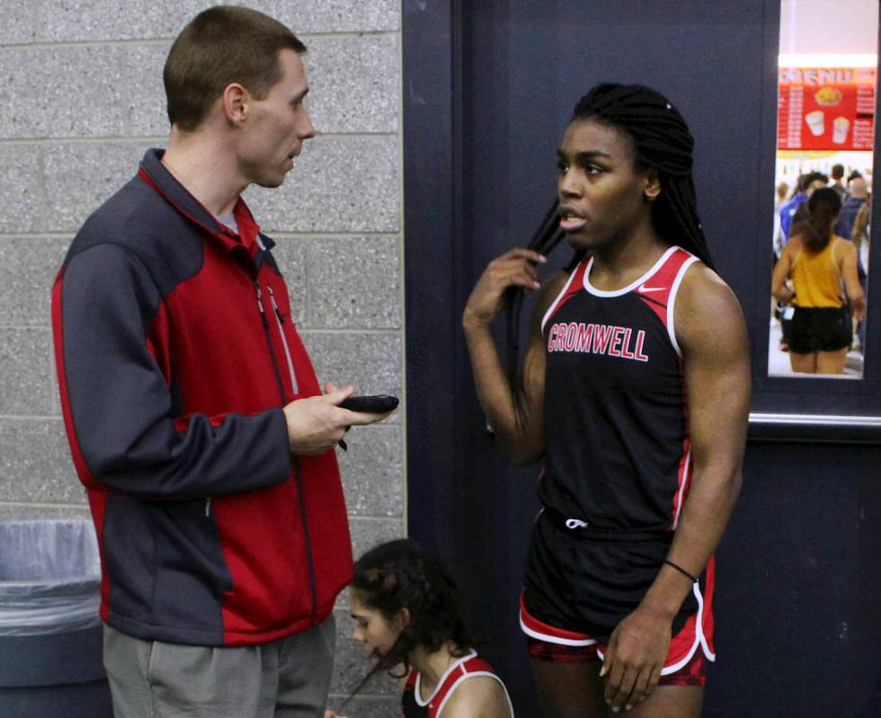 In this Feb. 7, 2019 file photo, Cromwell High School track coach Brian Calhoun, left, speaks t ...