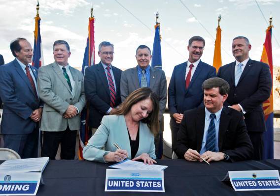 Commissioner of the U.S. Bureau of Reclamation Brenda Burman signs the interstate drought conti ...