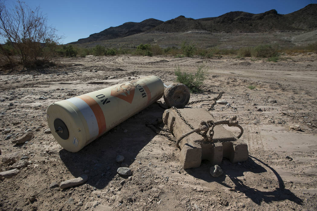 A buoy is seen high and dry near the defunct Echo Bay Marina at Lake Mead National Recreation o ...