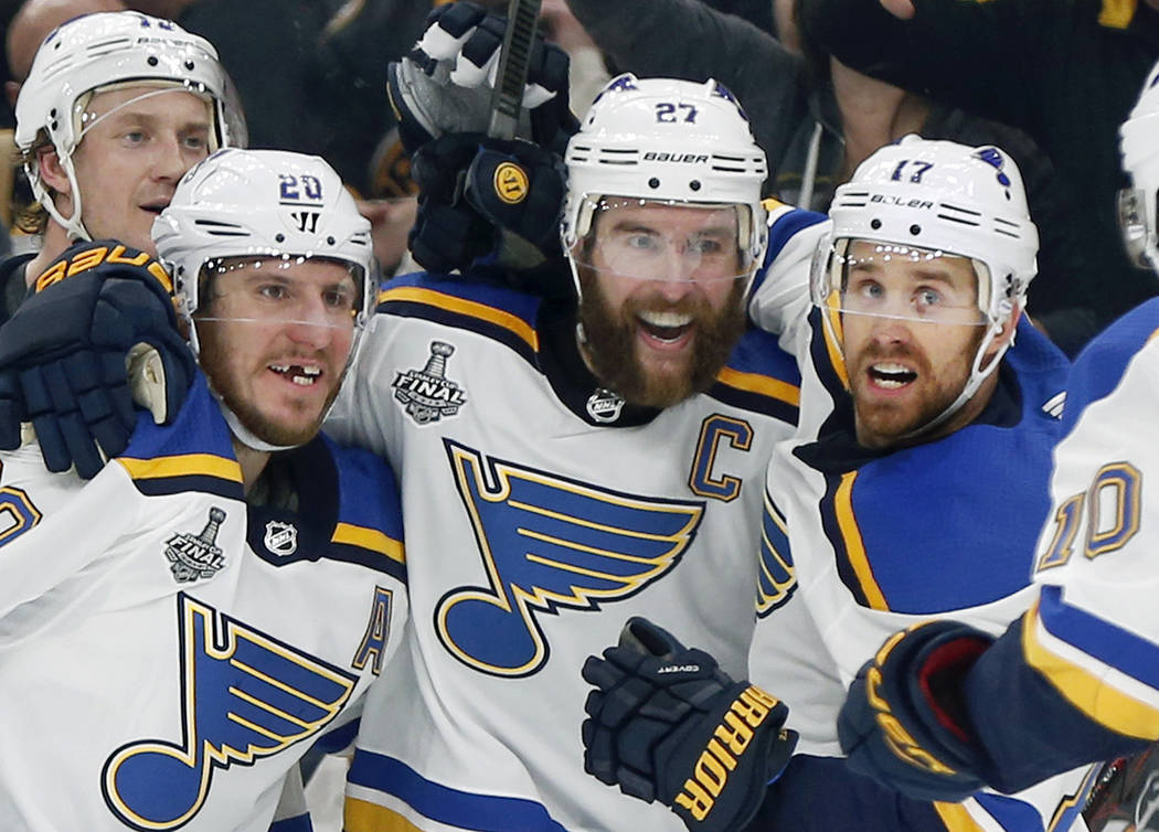 St. Louis Blues' Alex Pietrangelo, second from right, celebrates his goal with teammates Jay Bo ...