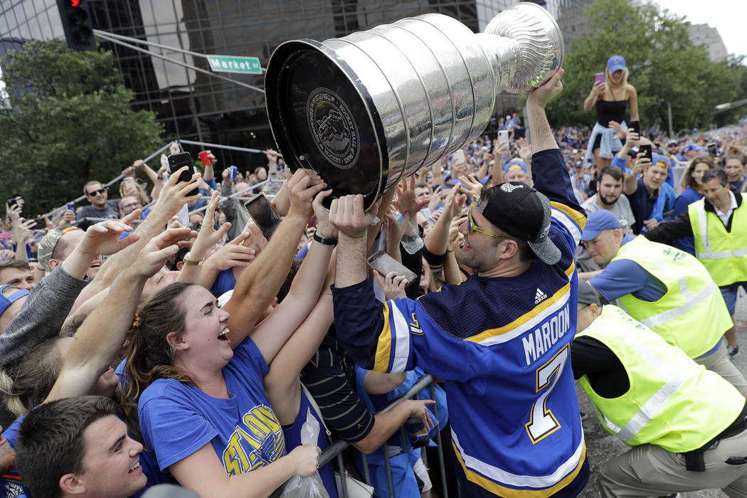 St. Louis Blues left wing Pat Maroon (7) celebrates with fans during the Blues' NHL hockey Stan ...
