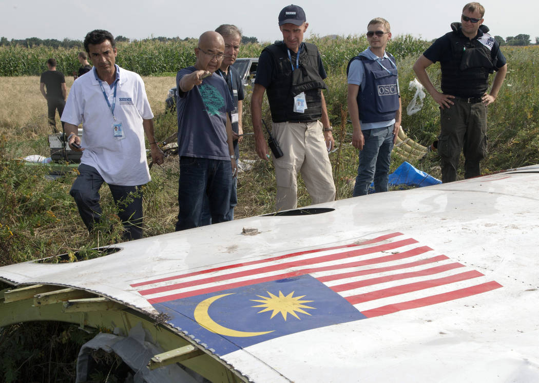 FILE In this file photo taken on Wednesday, July 23, 2014, Malaysian investigators along with m ...