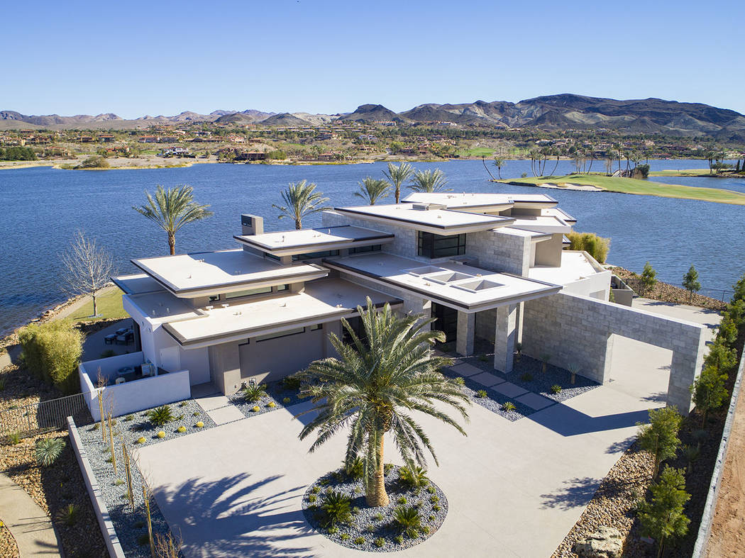 Sited on a 1.2-acre lot, the two-story, 8,838-square-foot desert-contemporary home is listed fo ...