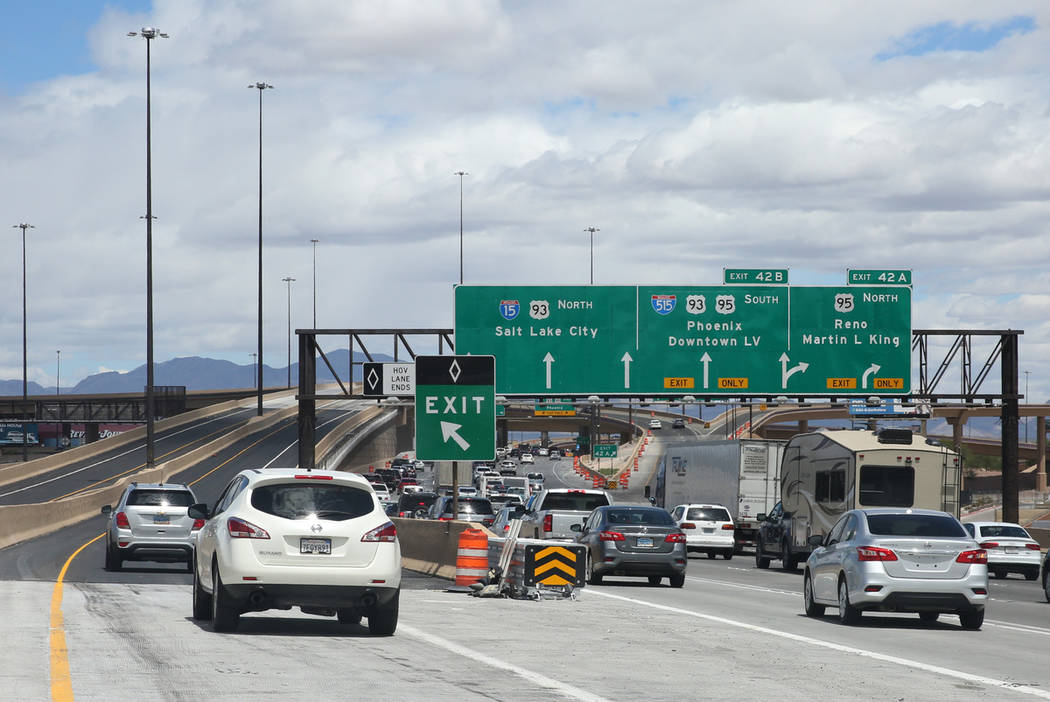 Motorists navigate through the newly completed Project Neon HOV flyover ramp in the Spaghetti B ...