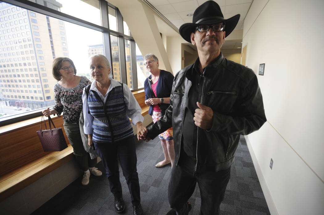 Timothy Hoffman, right, father of slain teenager Cynthia Hoffman receives support from Edie Gru ...