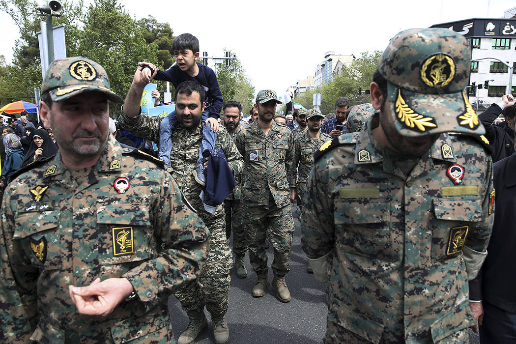 Members of the Iran's powerful Revolutionary Guards attend a rally against the U.S.'s decision ...