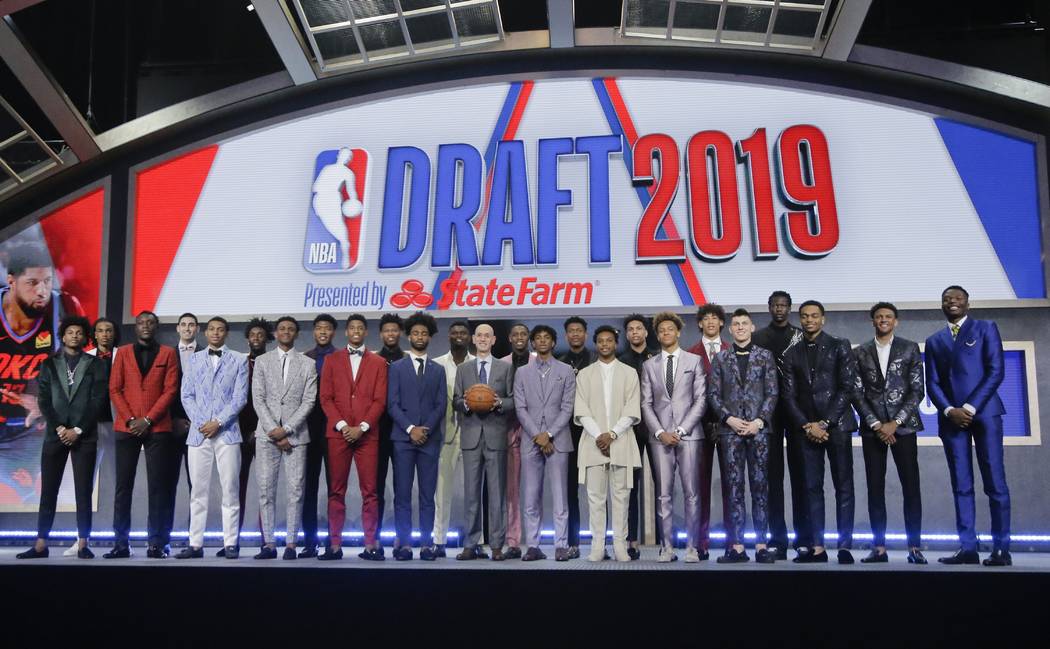 Prospective NBA draft picks pose for a group photo with NBA Commissioner Adam Silver, with bask ...