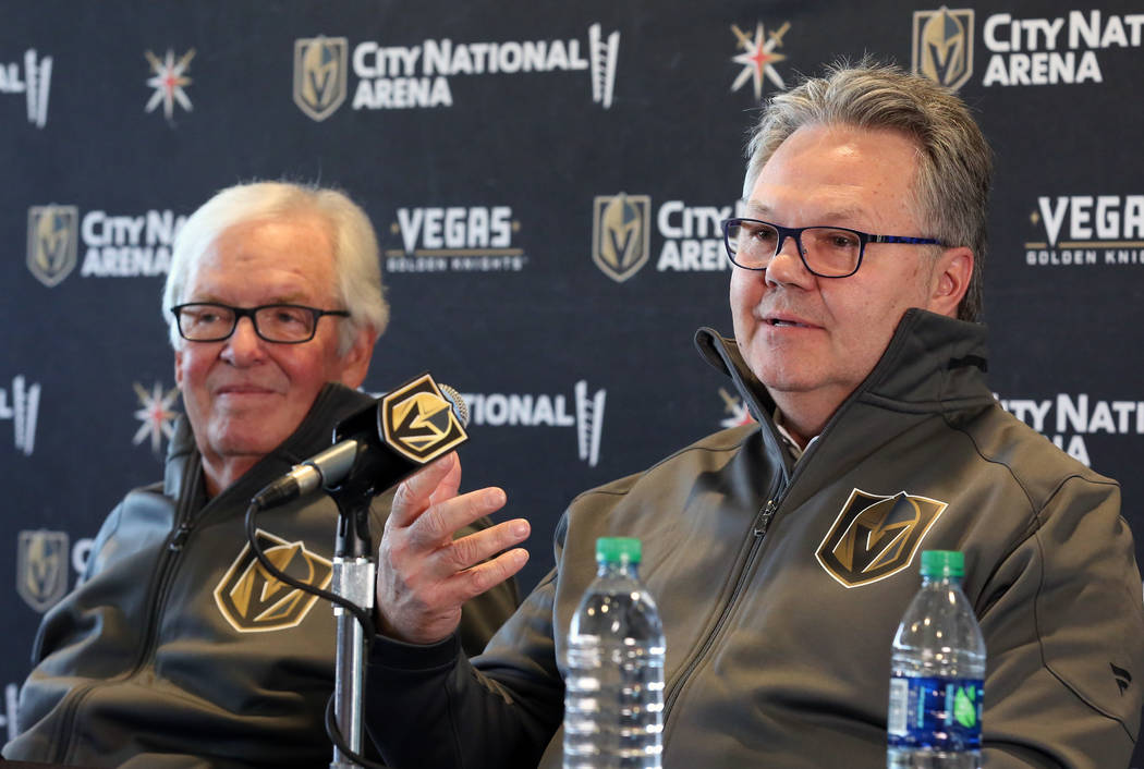 Golden Knights owner Bill Foley, left, listens as Kelly McCrimmon, the new general manager, spe ...