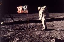 In an image provided by NASA, astronaut Buzz Aldrin poses for a photograph beside the U.S. flag ...