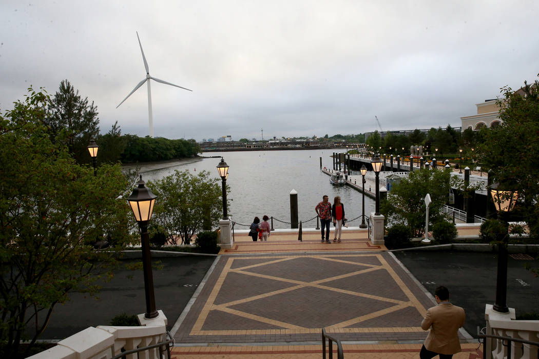 Guests take in the Mystic River during an invitation-only party at Encore Boston Harbor Thursda ...