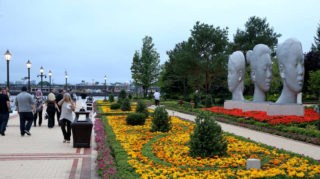 An art installation by sculptor Jaume Plensa on the river walk during an invitation-only party ...