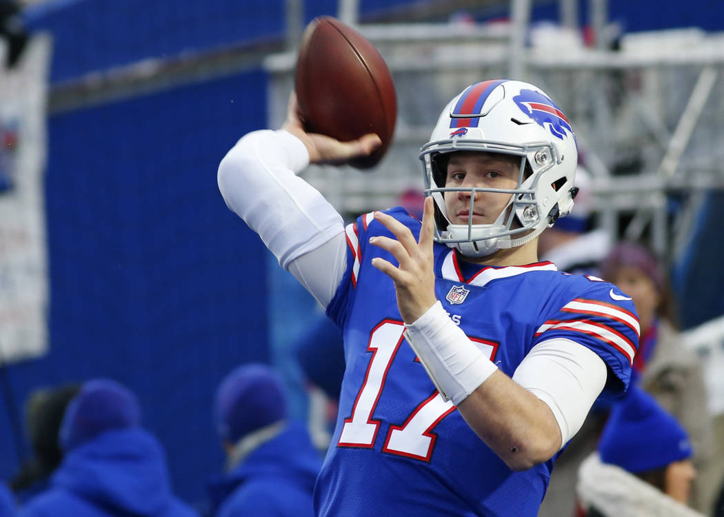 Buffalo Bills quarterback Josh Allen warms-up before an NFL football game against the Miami Dol ...