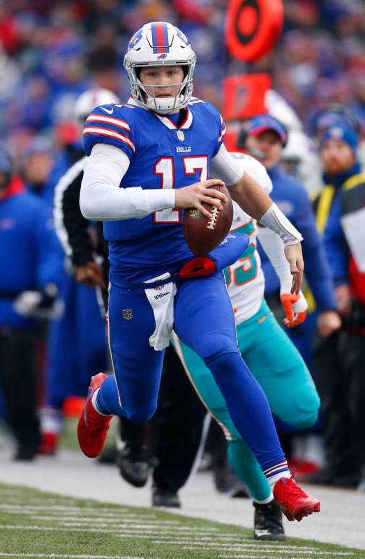 Buffalo Bills Josh Allen (17) carries the Ball during the second half of an NFL football game a ...