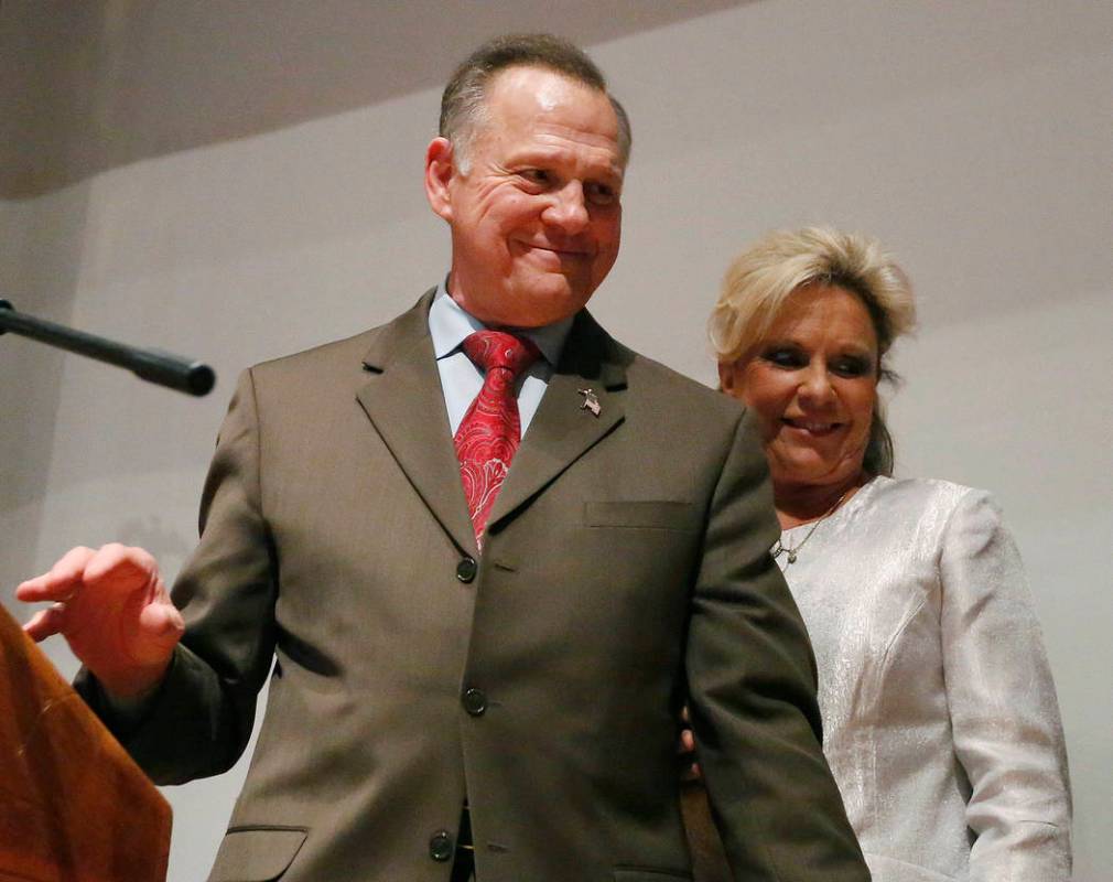 FILE - In this Tuesday, Dec. 12, 2017, file photo, Republican Senate candidate Roy Moore walks ...