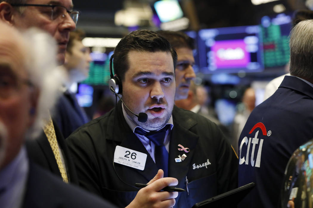 Trader Joseph Lawler works on the floor of the New York Stock Exchange, Thursday, June 20, 2019 ...