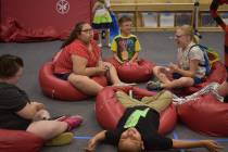The children in the Nevada Blind Children's Foundation Discovery Day Camp play hot potato on be ...