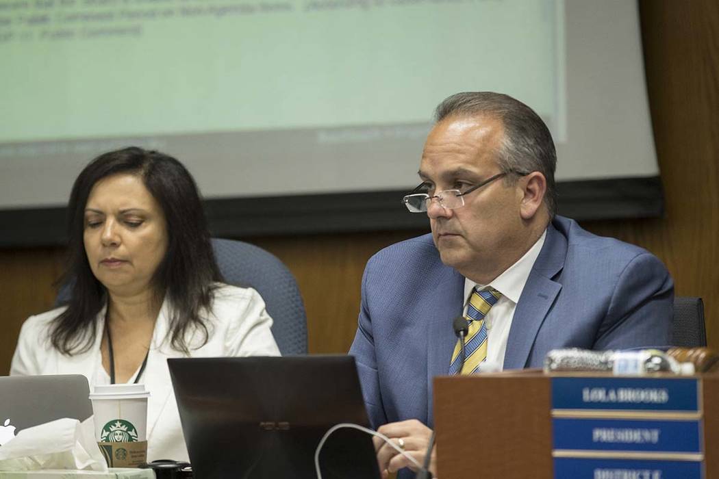 Clark County School Superintendent Dr. Jesus Jara, right, listens to public comments during a m ...