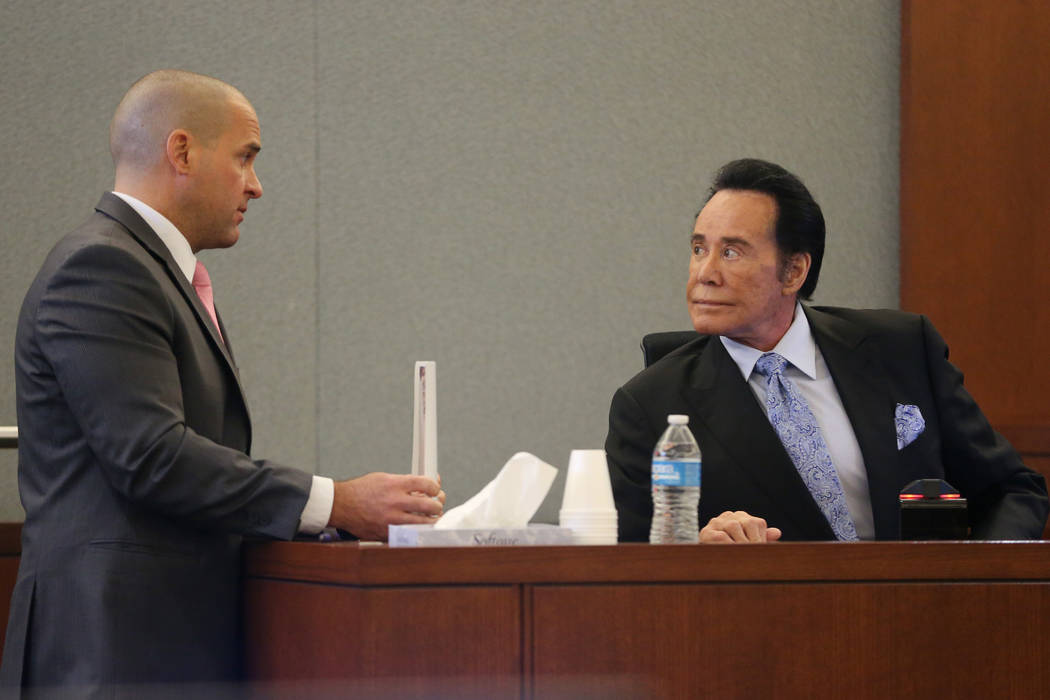 District Attorney John Giordani, left, speaks to Wayne Newton during the trial of Weslie Martin ...