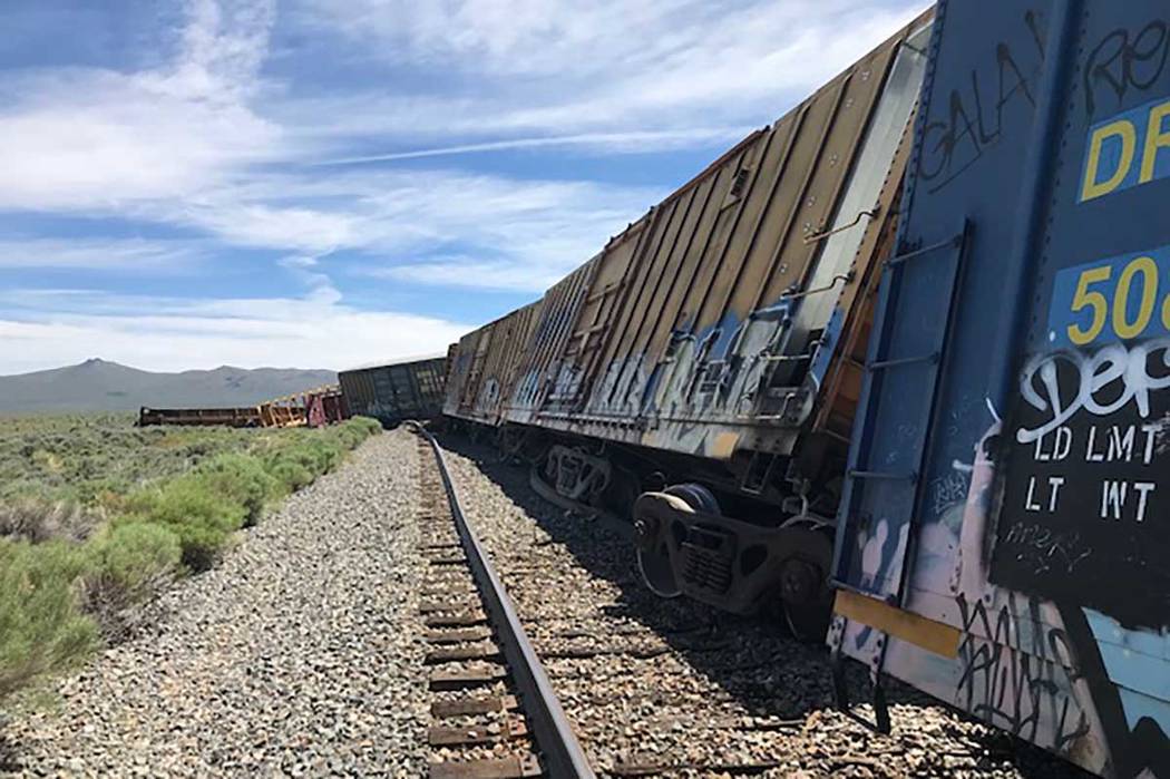 A freight train carrying military munitions, headed for the Hawthorne Army Depot in Nevada, der ...