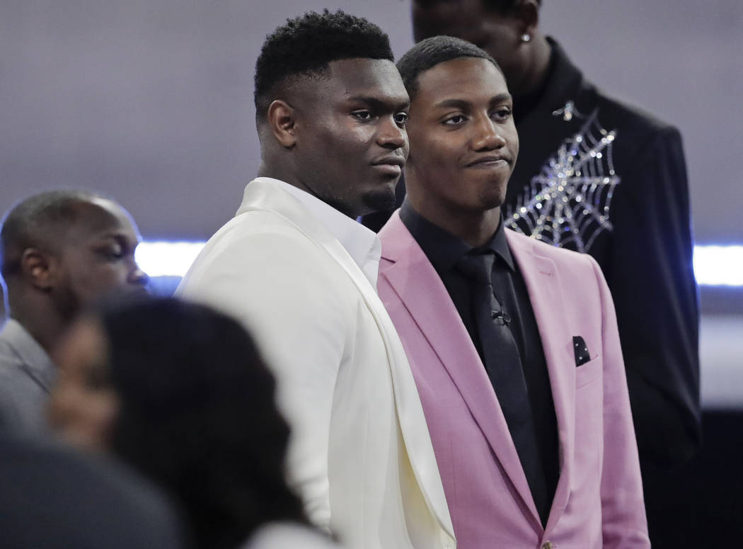 Duke's Zion Williamson, left, and RJ Barrett speak before the NBA basketball draft Thursday, Ju ...