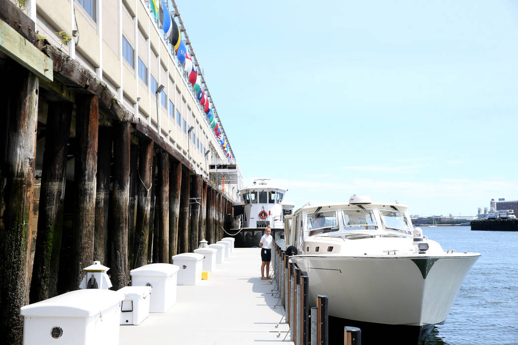 Crew member Katelyn Stimpson ties a luxury harbor shuttle from Encore Boston Harbor in Everett, ...