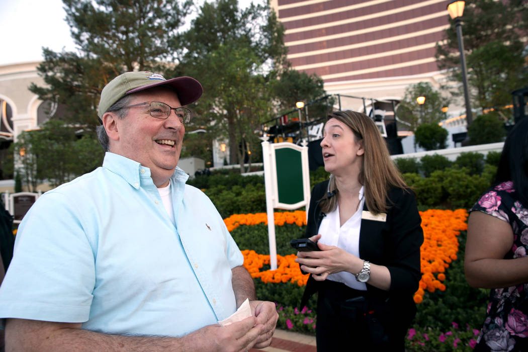 Bob Doucette, 57, of Swampscott, Mass., visits with Red Card shift manager Jill Delisle in line ...