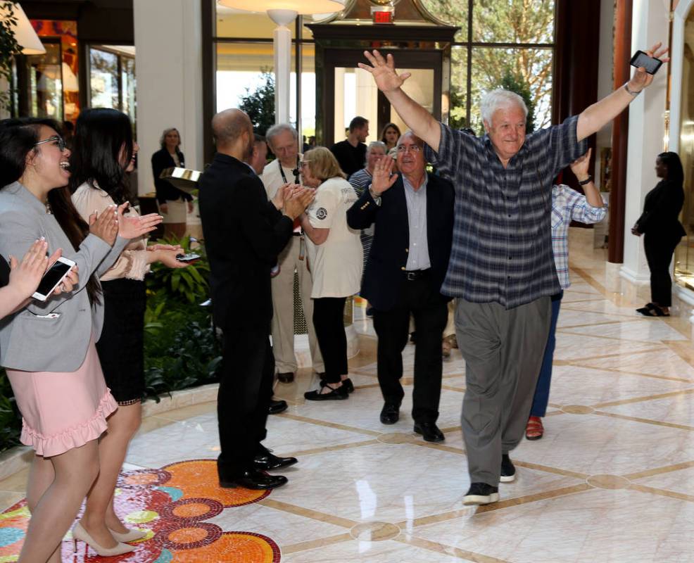 Employees cheer as Frank Susi of Boston arrives in the Garden Lobby during the opening of the $ ...