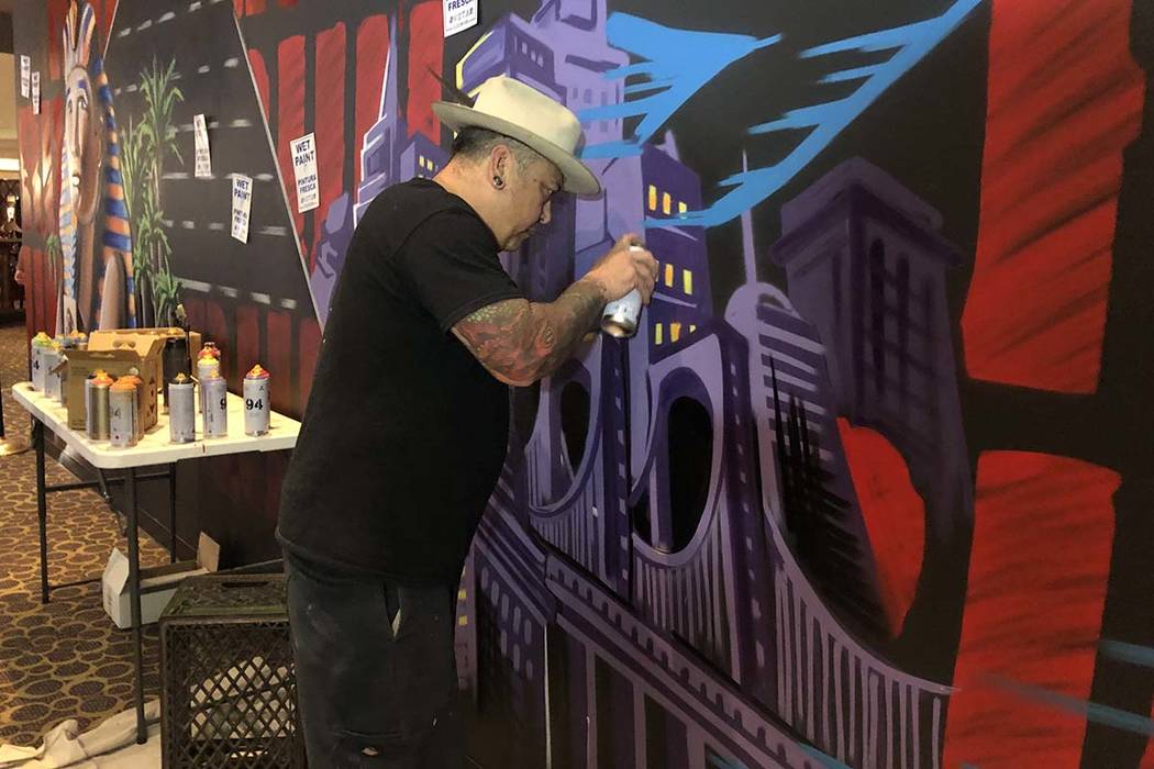 Jay James, aka Tiki Jay One, works on the "R.U.N" art installation at Luxor on Friday, June 21, ...