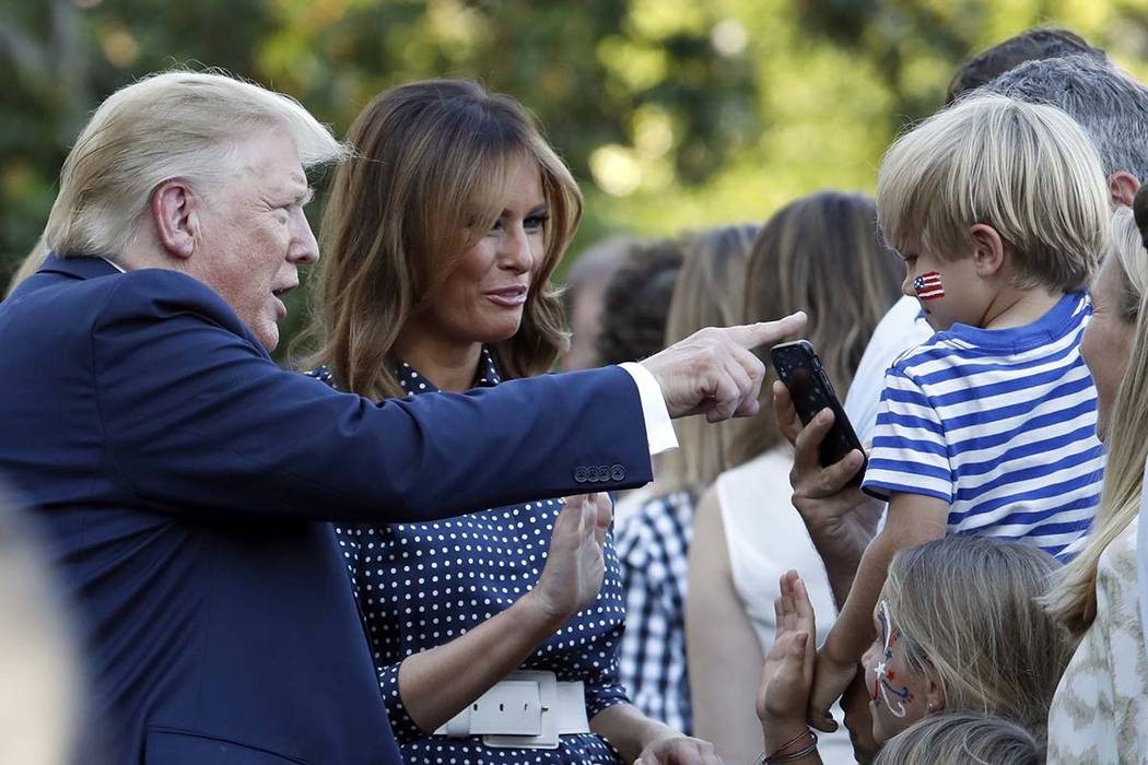 President Donald Trump and first lady Melania Trump greet attendees of the annual Congressional ...