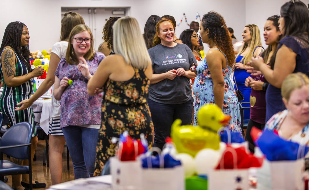 Invited guests greet and ask questions of each other during the Operation Homefront sponsored S ...