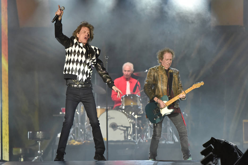 Mick Jagger, from left, Charlie Watts, and Keith Richards of The Rolling Stones performs during ...