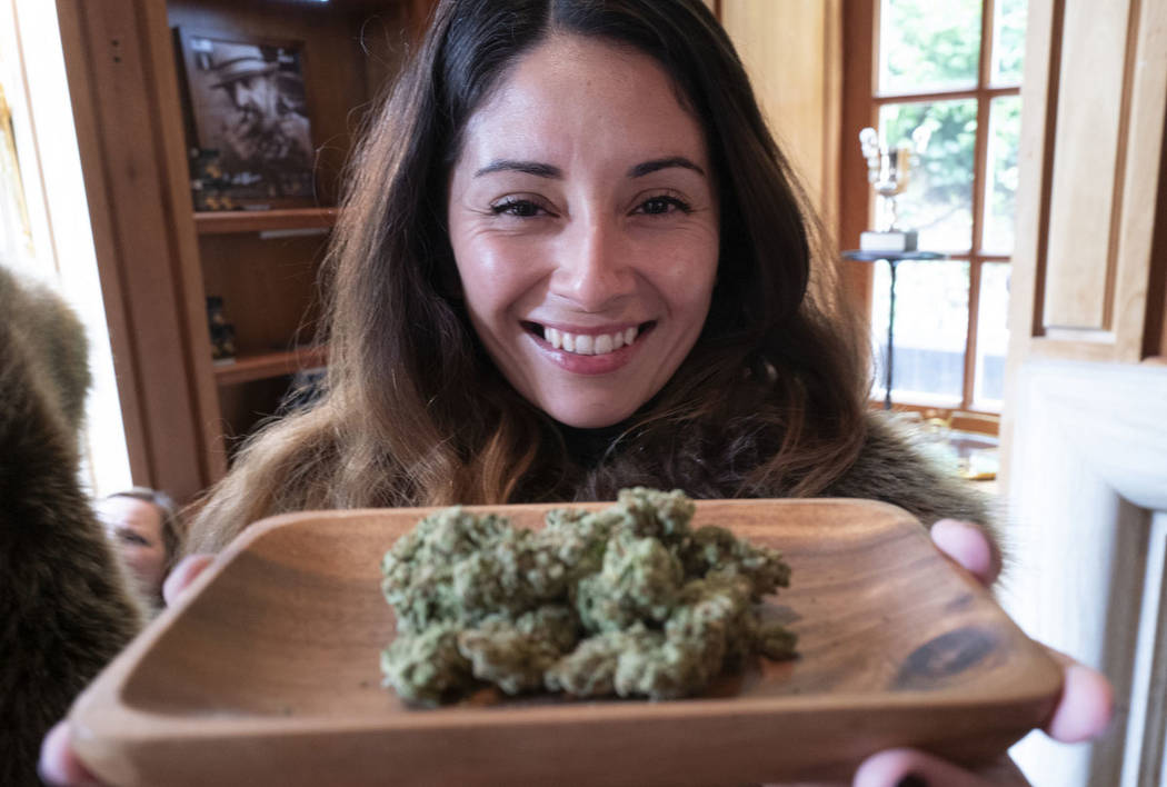 Christy Banda, a representative for the Jack Herer cannabis company, displays their latest mari ...