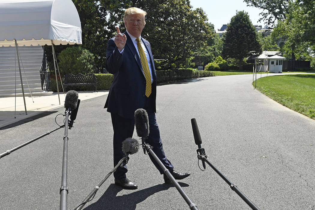 President Donald Trump speaks to reporters on the South Lawn of the White House in Washington, ...