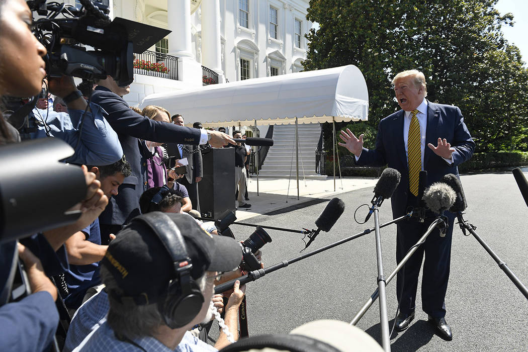 President Donald Trump speaks to reporters on the South Lawn of the White House in Washington, ...