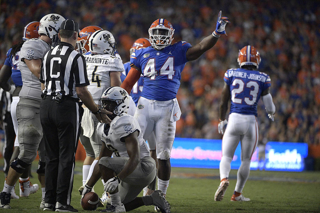 Florida linebacker Rayshad Jackson (44) celebrates after tackling Charleston Southern running b ...