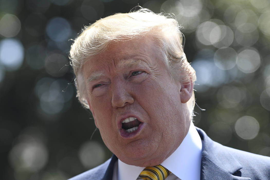 President Donald Trump speaks to reporters on the South Lawn of the White House in Washington, ...