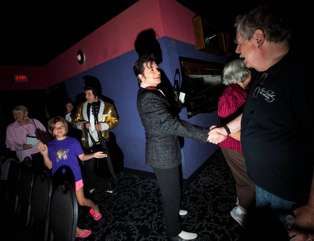 Elvis tribute artist Matthew Boyce, of Saratoga Springs, N.Y., greets fans after winning first ...