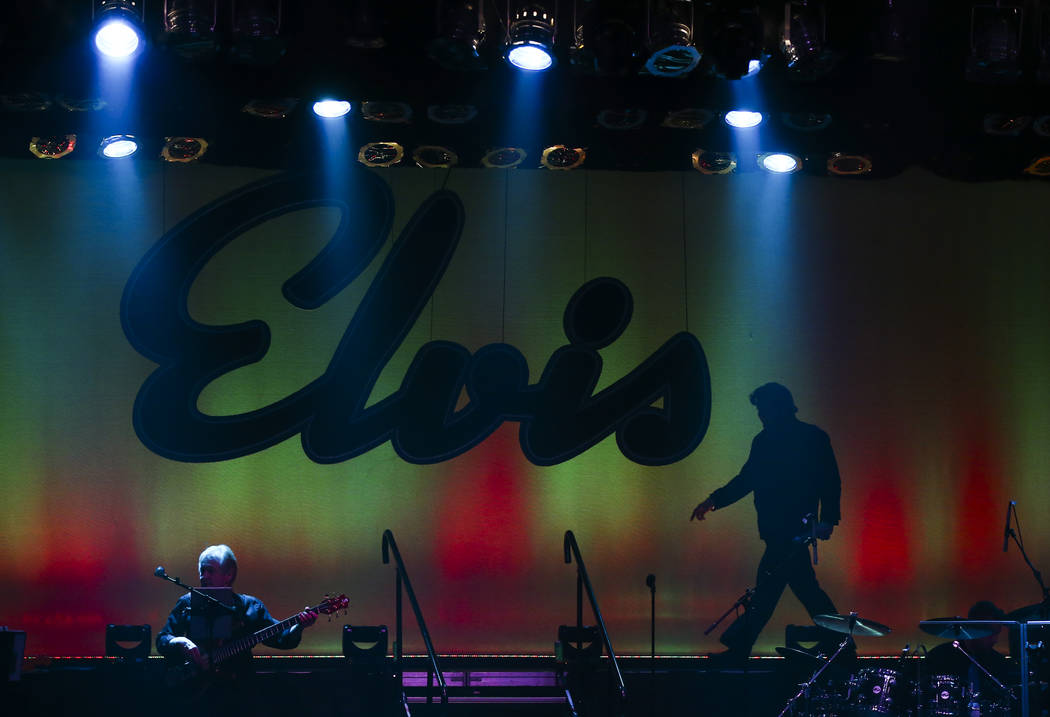 Jim Westover, of Arizona City, Ariz., is silhoutted at the start of a performance in the '60s e ...