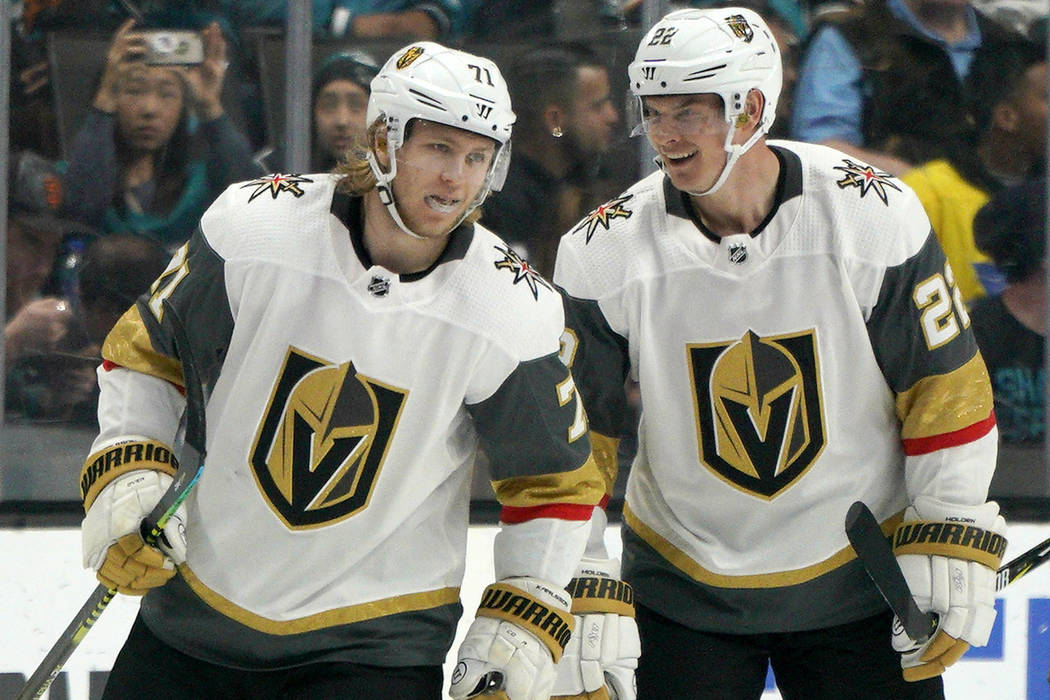 Vegas Golden Knights center William Karlsson (71) is congratulated by teammate Nick Holden (22) ...