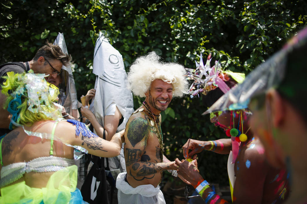 Parade attendees in costume make their way along Surf Avenue during the 37th annual Mermaid Par ...