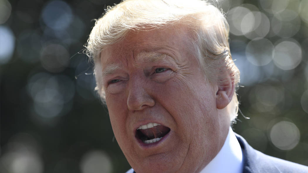 President Donald Trump speaks to reporters on the South Lawn of the White House in Washington, ...