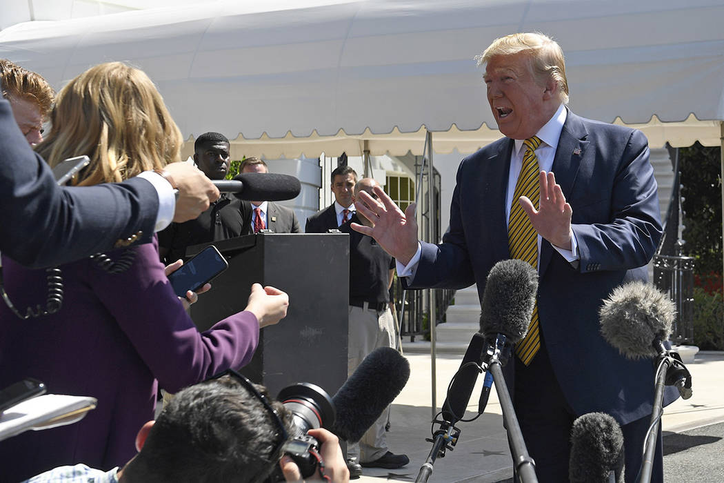 President Donald Trump speaks to reporters on the South Lawn of the White House in Washington, ...