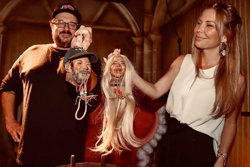 Branden and Lisa Marie Powers show off their shrunken heads on their first wedding anniversary ...