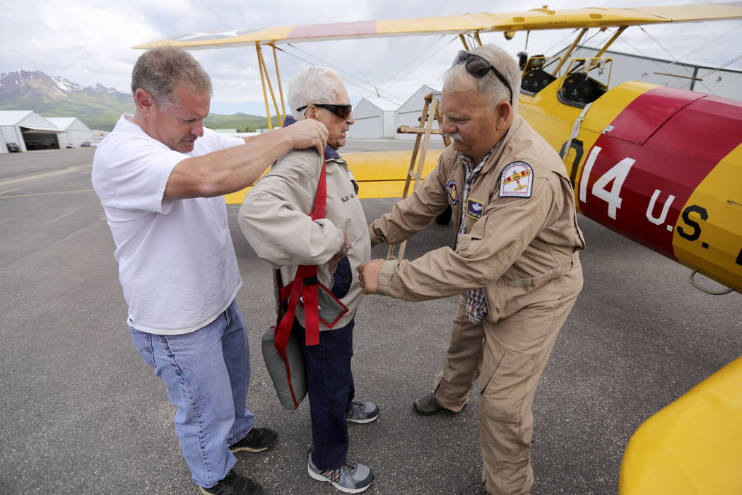 In this June 14, 2019, photo Dane Wilkinson, left, and Doug Compton, right, help retired Air Fo ...