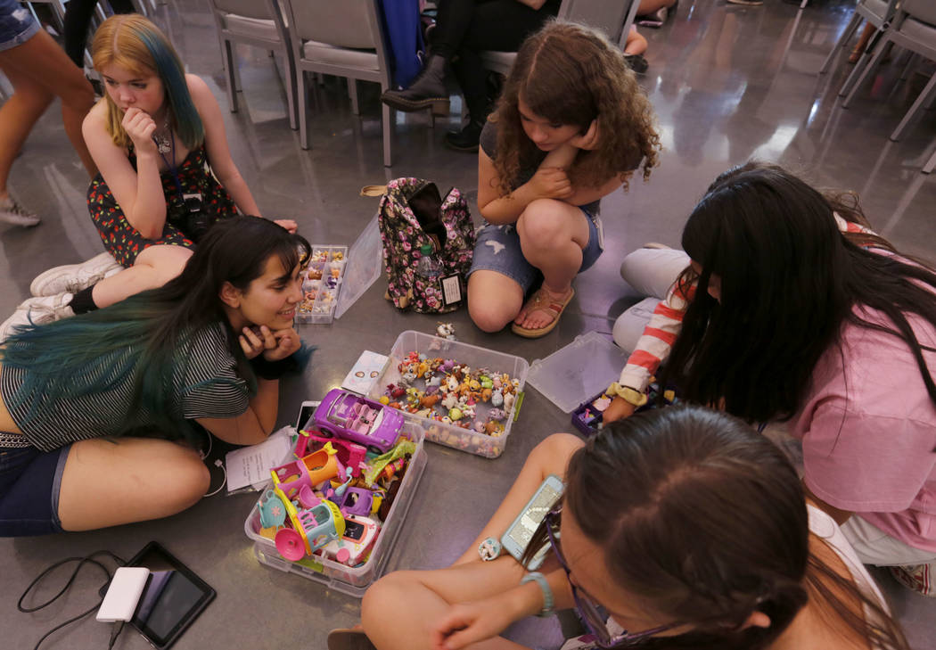 Angelica Sanchez, 17, of Los Angeles, foreground left, shows her Littlest Pet Shop collection t ...