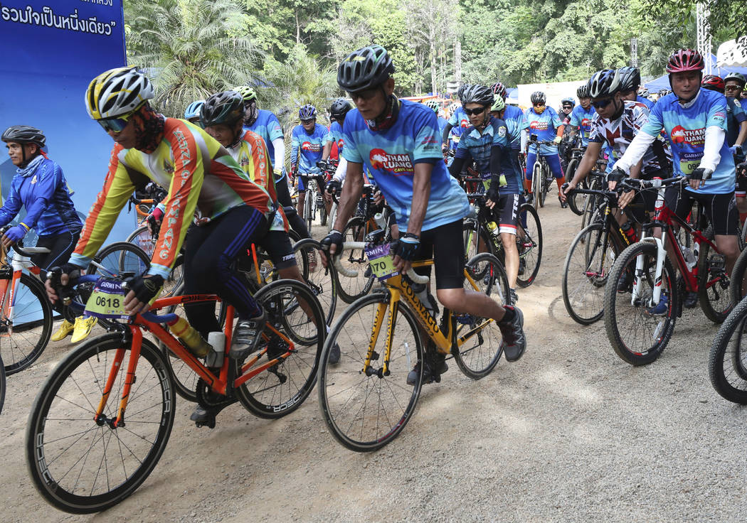 Participants start during a marathon and biking event in Mae Sai, Chiang Rai province, Thailand ...