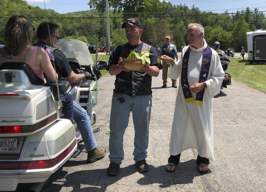 Motorcyclists participate in a "Blessing of the Bikes" ceremony in Columbia, N.H., Su ...