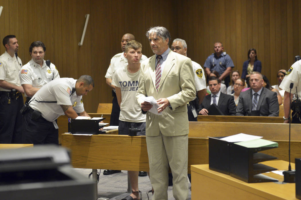 Volodymyr Zhukovskyy of West Springfield stands while his attorney Donald Frank speaks during h ...