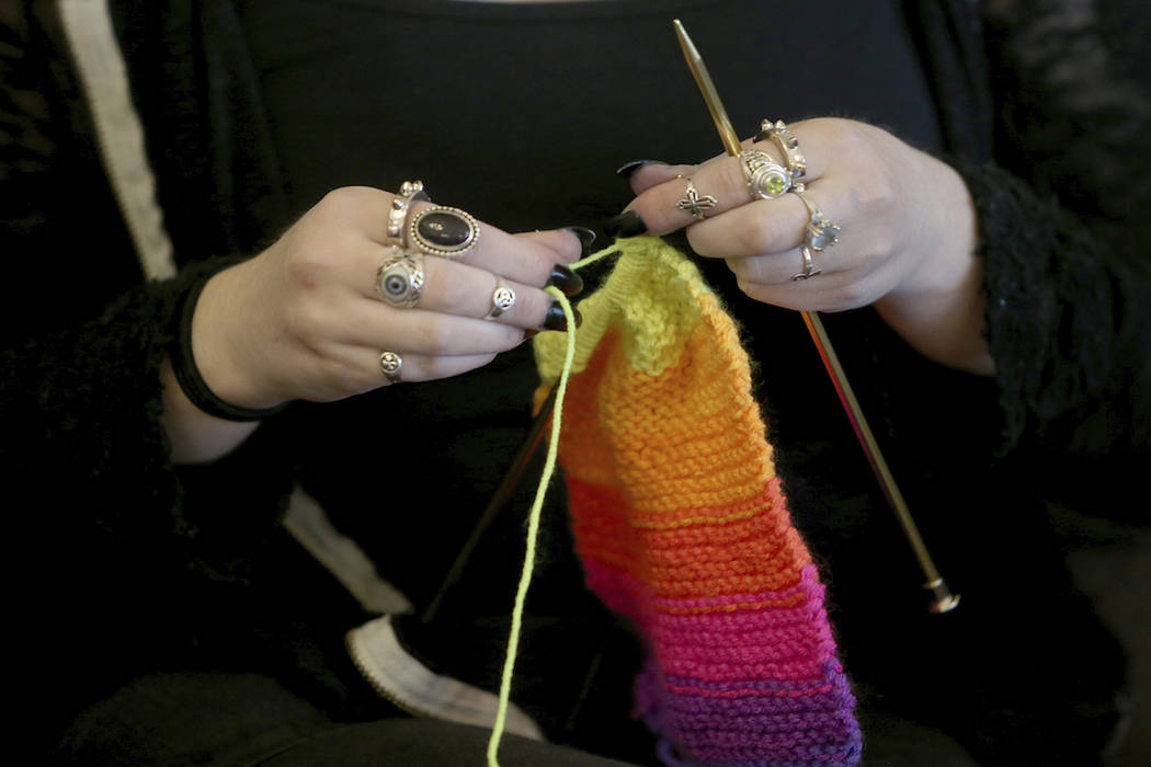 This April 30, 2018 file photo shows a woman knitting in Silverdale Wash. A free, 8-million str ...