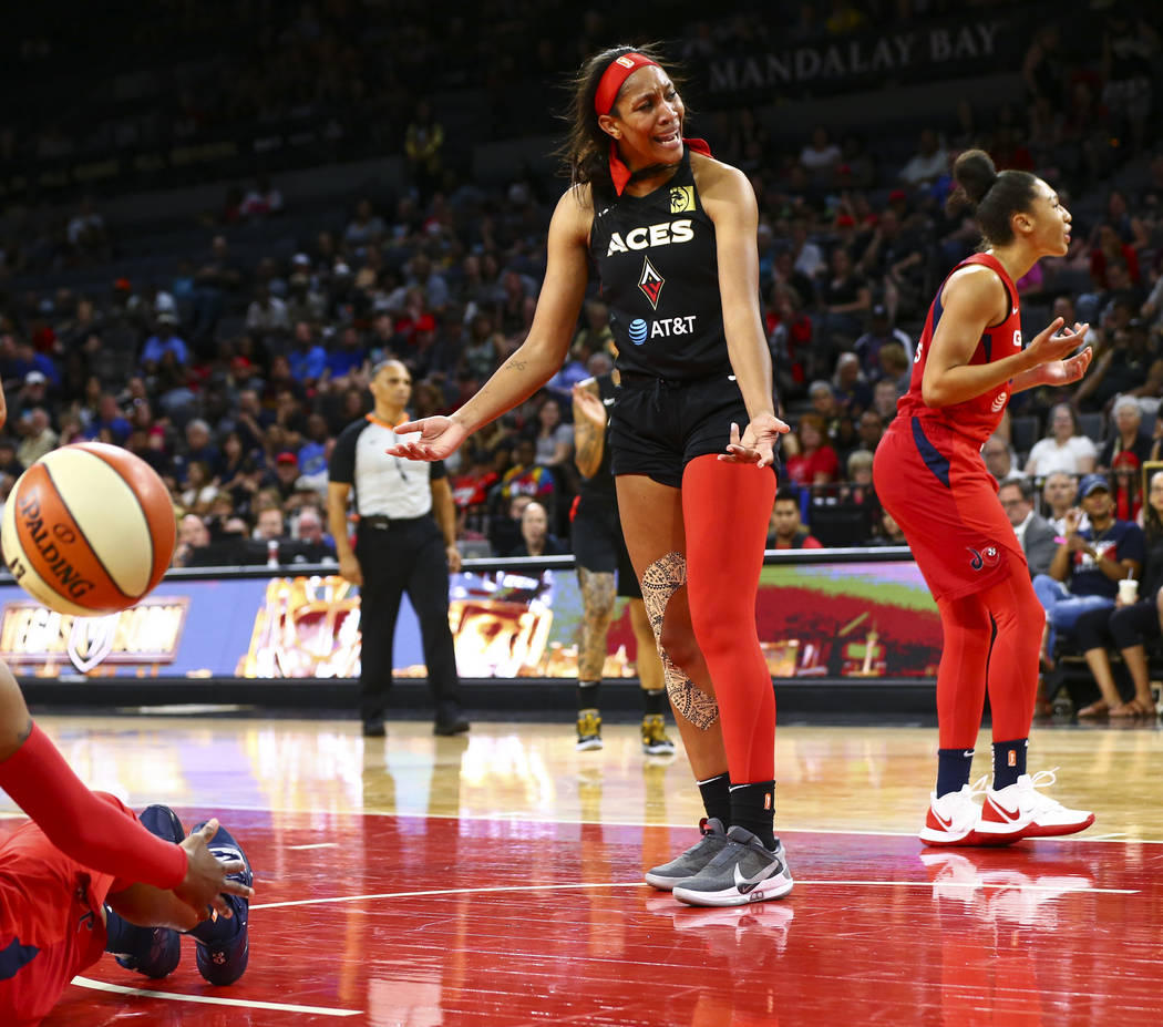 Las Vegas Aces center A'ja Wilson (22) reacts after getting fouled by a Washington Mystics play ...